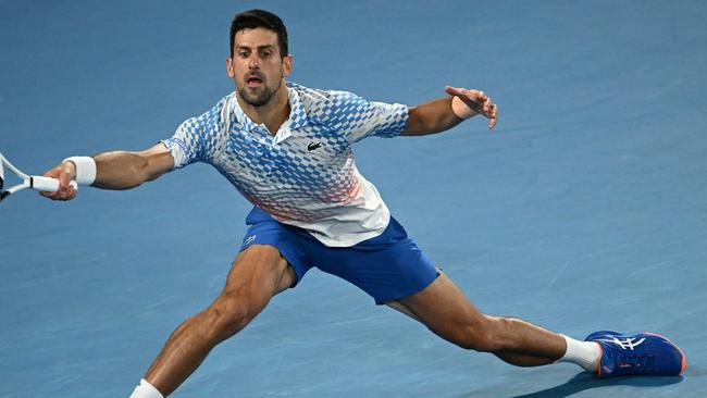 MELBOURNE, AUSTRALIA - JANUARY 29: Novak Djokovic of Serbia plays a forehand in the MenÃ¢â¬â¢s Singles Final against Stefanos Tsitsipas of Greece during day 14 of the 2023 Australian Open at Melbourne Park on January 29, 2023 in Melbourne, Australia. (Photo by Quinn Rooney/Getty Images)