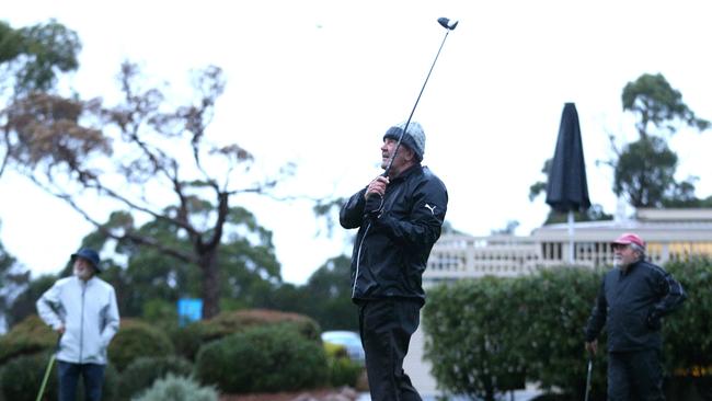 Barry Graham was the first to tees off with playing group Tony Fenton (left) and Graham Marshall (right) at Mount Martha Public Golf Course. Picture: Hamish Blair