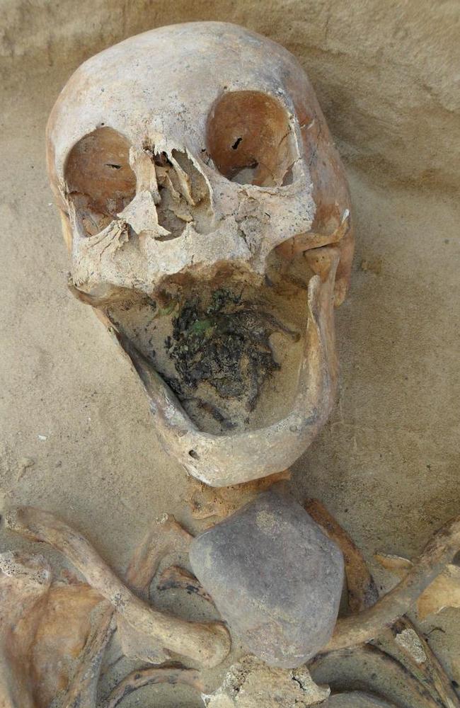 Victim of suspicion ... This skeleton of a woman, 45—49, had a large stone placed directly on top of the throat. Source: PLOS ONE