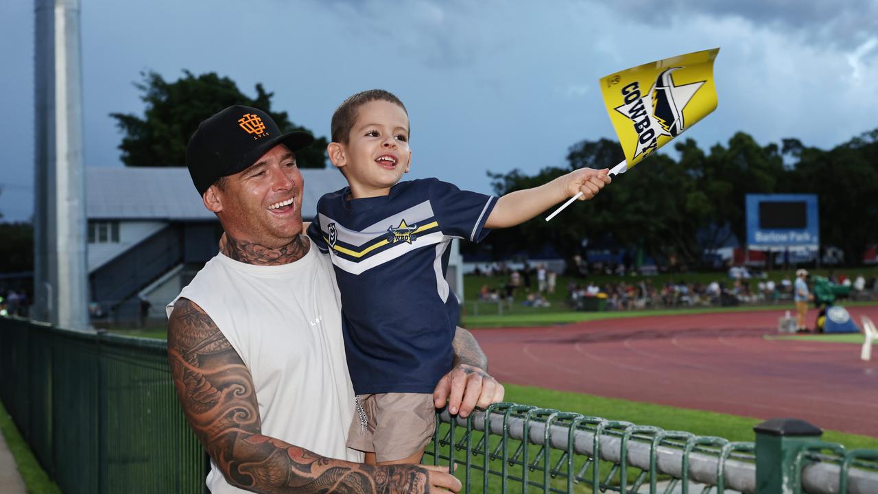 Curtis Fitzgerald and Tully Fitzgerald, 3, cheer on the Cowboys at the NRL preseason match between the North Queensland Cowboys and the Dolphins, held at Barlow Park. Picture: Brendan Radke