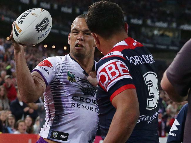 Melbourne's William Chambers and Roosters Latrell Mitchell have melee during the 2018 NRL Grand Final between the Sydney Roosters and Melbourne Storm at ANZ Stadium, Sydney. Picture: Brett Costello