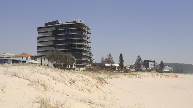 The Pacific Palm Beach development towers over neighbouring buildings.