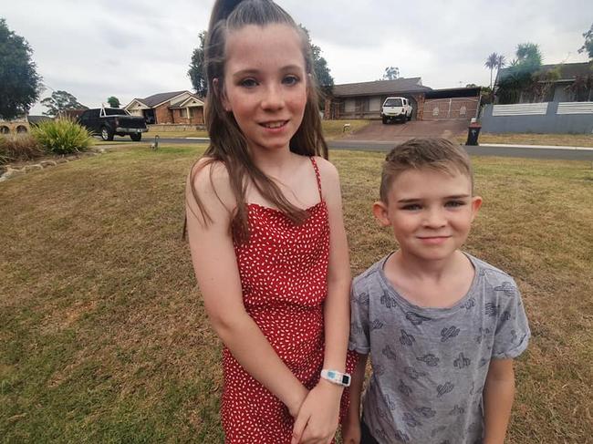 Matilda Saunders with her little brother Caden, 7. Caden has a cecostomy tube due to bowel issues. Picture: Facebook.