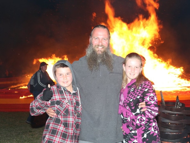 Quincey Schmidt from the Sunshine Coast celebrating his 10th Birthday at the Killarney Bonfire and Fire Drum Night pictured with his father Mick and sister Gypsey on Saturday, July 24, 2016.