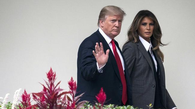 FILE - In this Wednesday, Oct. 11, 2017 file photo, President Donald Trump walks along the Colonnade with first lady Melania Trump on his way to board the Marine One helicopter on the South Lawn of the White House in Washington for a short trip to Andrews Air Force Base, Md., and then onto Harrisburg, Pa. First lady Melania Trump's office is fed up with speculation about marital strife in the White House. Mrs. Trump's spokeswoman, Stephanie Grisham, took to Twitter Friday, Jan. 26, 2018 to blast "flat-out false reporting" about the first lady that has emerged in recent days.  (AP Photo/Carolyn Kaster, File)