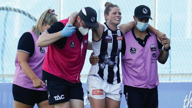 Collingwood’s Brianna Davey is helped from the field after suffering an ACL tear. Picture: Michael Willson/AFL Photos