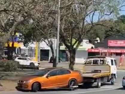 The Holden Commodore being taken away by a tow truck. Picture: Dennis Taunoa