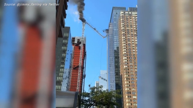 New York City crane catches fire, collapses into building