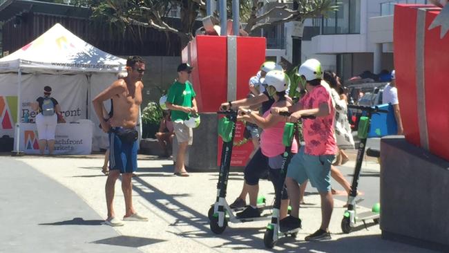 Gold Coasters take a spin on the new Lime e-scooters now available to hire in Surfers Paradise. Photo: Talisa Eley