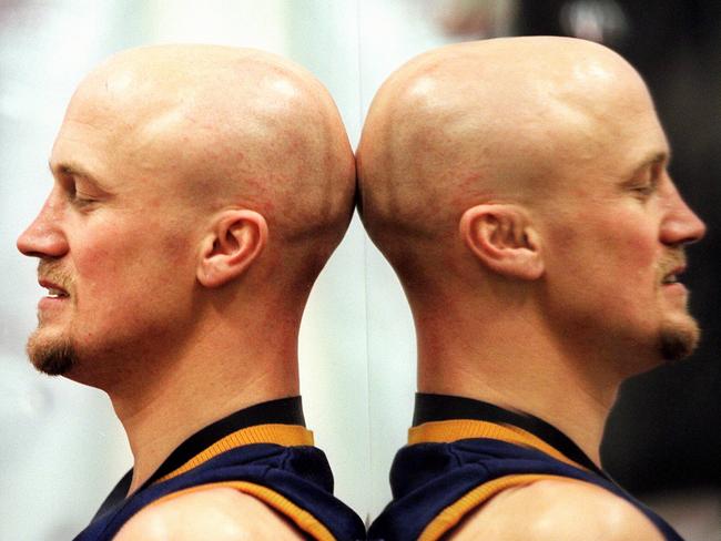 Footballer Nigel Smart and reflection.AFL football - Adelaide Crows vs North Melbourne 1998 grand final premiership match at the MCG.