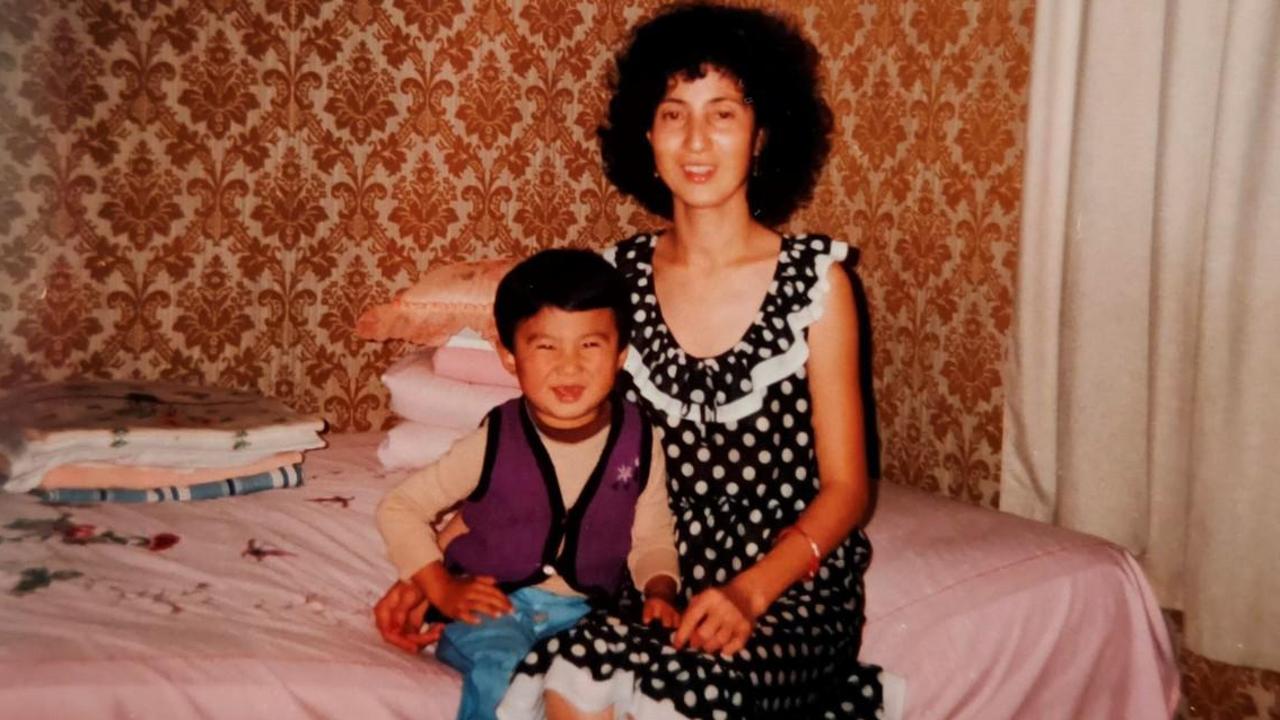 Bruce, pictured as a kid with his mum who arrived as a refugee from China, didn’t grow up wealthy. Picture: Supplied