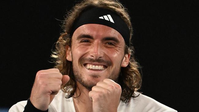 Tsitsipas is all smiles after the match.