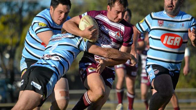 Matt Foster, from Wallumbilla/Surat Red Bulls, get caught by a Devils player. Picture: Molly Hancock