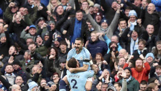 Manchester City's Ilkay Gundogan, top, celebrates with Kyle Walker after scoring his side's fourth goal (AP Photo/Jon Super)