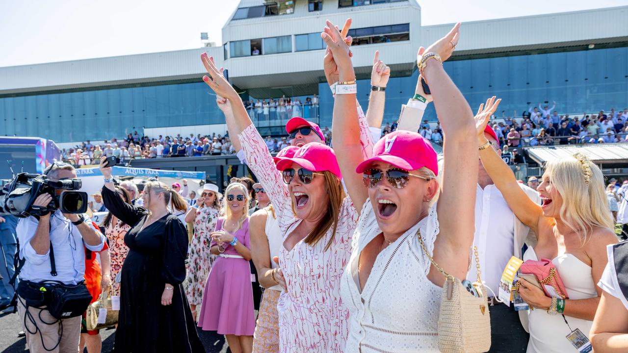 Sasha Morris and Rachael Kelly celebrate after their horse Skirt the Law wins race 3 at Magic Millions race day. Picture: Luke Marsden.