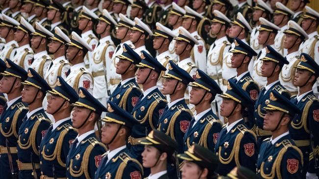 Chinese People's Liberation Army honour guard wait for the welcome ceremony for Sierra Leone President Julius Maada Bio at the Great Hall of the People in Beijing on Thursday. Picture: AFP<lr/>