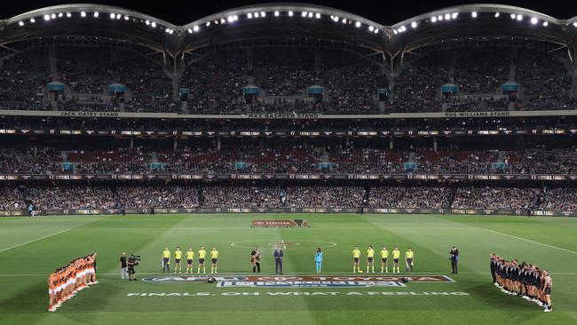 A minute’s silence for Ron Barassi was observed before Saturday night’s clash. Picture: Sarah Reed/AFL Photos