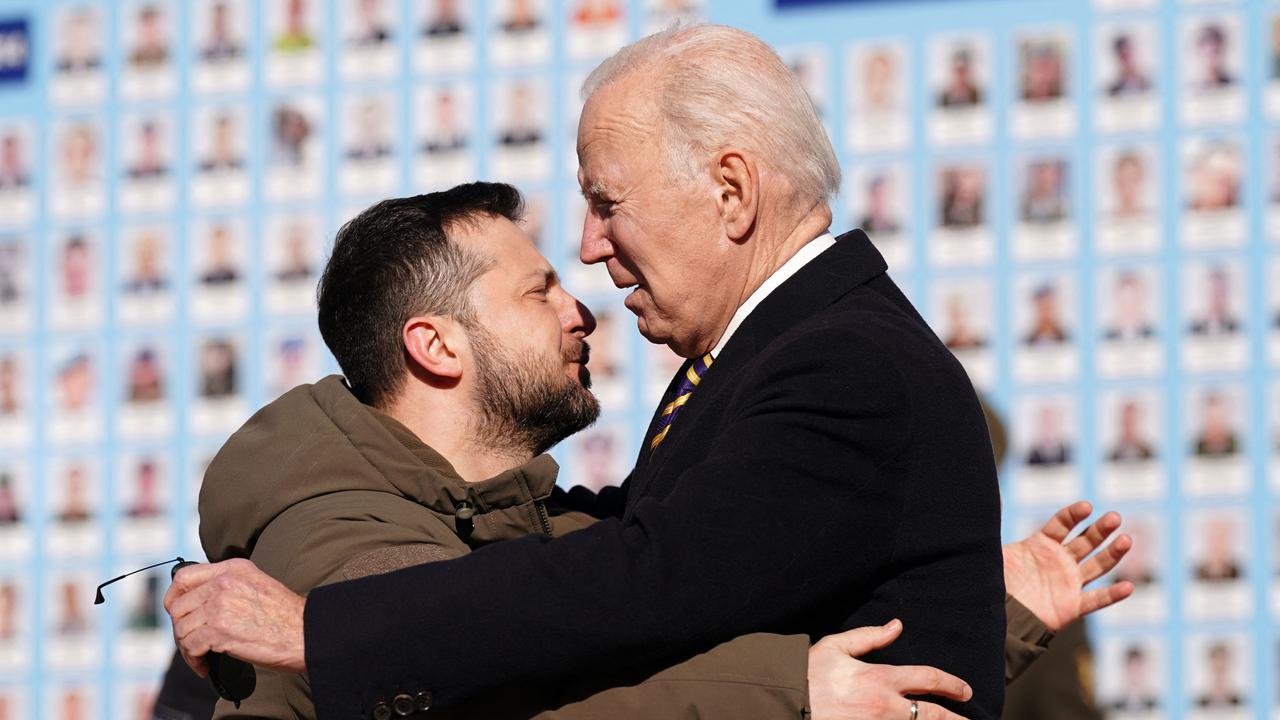 US President Joe Biden is greeted by Ukrainian President Volodymyr Zelensky. (Photo by Dimitar DILKOFF / AFP)