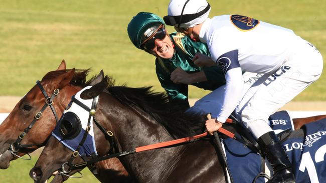 Capitalist ridden by Blake Shinn, wins the Golden Slipper and is congratulated by Zac Purton on Yankee Rose during Golden Slipper day at Rosehill Races. pic Jenny Evans