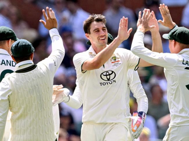 Australia's Pat Cummins celebrates taking a wicket on the third day of the second cricket Test match between Australia and India at the Adelaide Oval in Adelaide on December 8, 2024. (Photo by William WEST / AFP) / -- IMAGE RESTRICTED TO EDITORIAL USE - STRICTLY NO COMMERCIAL USE --