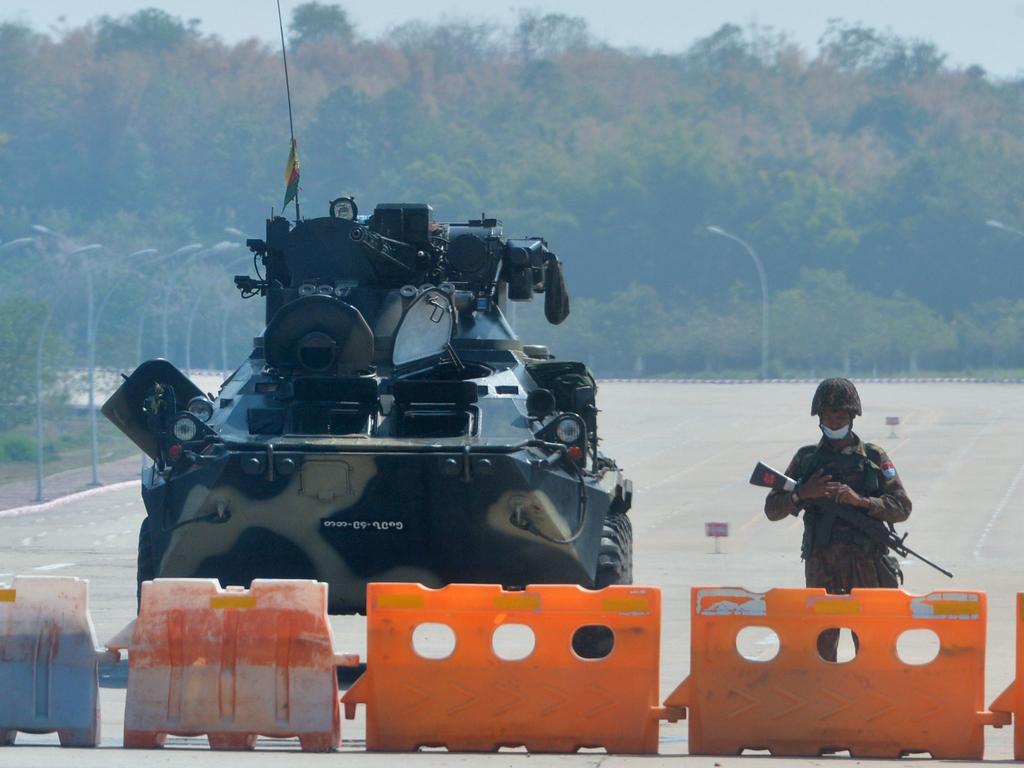 A soldier stands guard on a blockaded road to Myanmar's parliament in Naypyidaw. Picture: Stringer/AFP