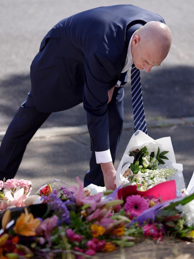 Premier Peter Gutwein lays flowers at Hillcrest Primary School. Picture: NCA Newswire / Grant Viney