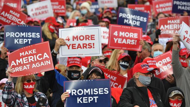 Supporters listen to US President Donald Trump speak during a campaign rally at Pickaway Agriculture and Event Center in Circleville, Ohio.