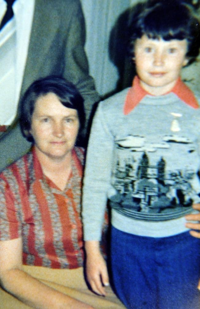 A young Hughesy with his mum.