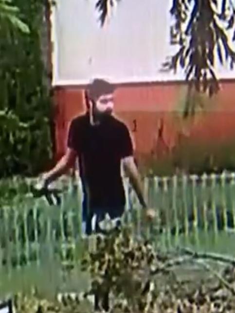 The man can be ween with a belt in his hand. Picture: 7 News
