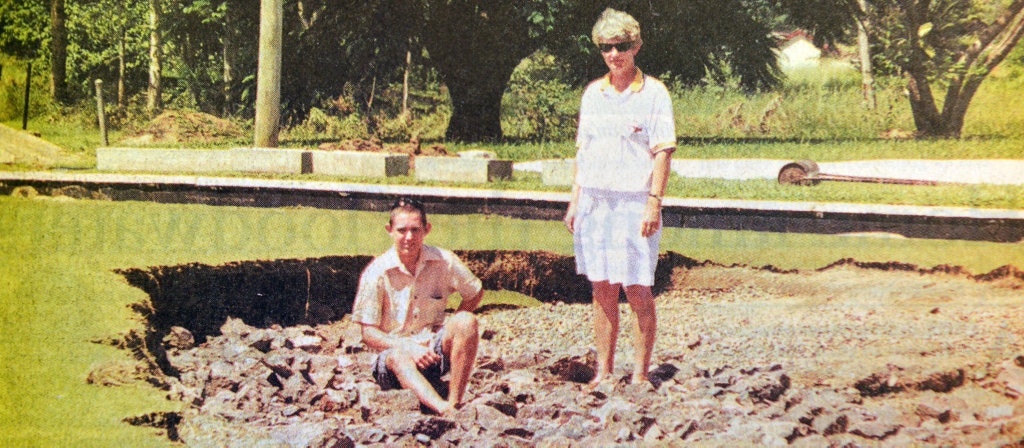 1999 FLOOD KAndanga bowls club junior bowler Matthew Warne and the club's Australian representive Jenny Harragon stan in the middle of a huge hole in the Kandanga Club's green caused by the Fedruary flood, despite the set back , the small Mary Valley club played bowls the following week. Picture: Renee Albrecht