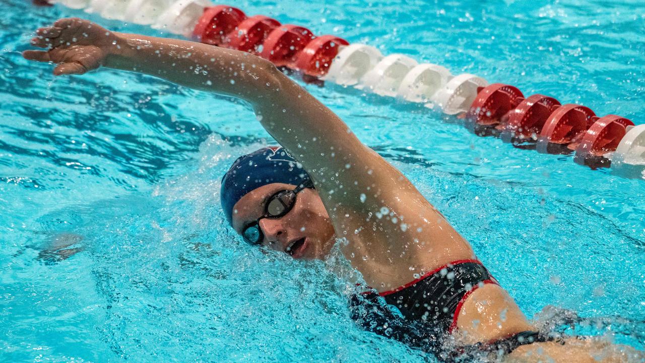 Lia Thomas swims for the University of Pennsylvania at an Ivy League swim meet against Harvard. (Photo by Joseph Prezioso / AFP)