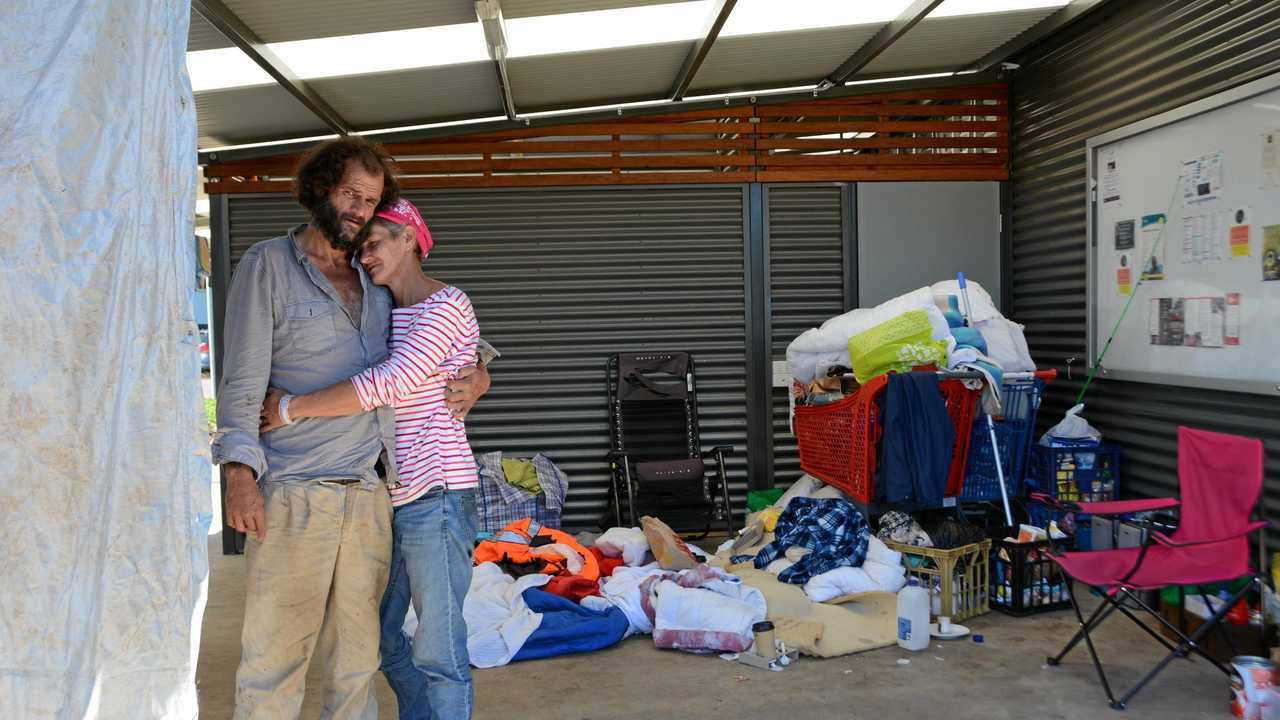 FORGOTTEN: Aaron Burke, 34, and partner Michelle Sharpe, 43, sit amidst everything they own in a makeshift shelter at Clewley Park off Water St. It has been the couple's home for two months. Picture: Tara Miko