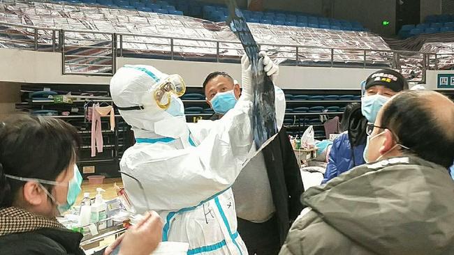 Health workers at a makeshift hospital in Wuhan. Picture: AFP.