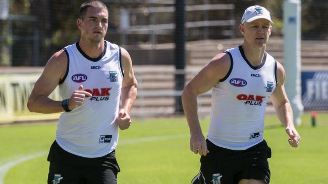 Robbie Gray, right, on the training track with new Power recruit Tom Rockliff after returning to Alberton in November. Picture: AAP Image/Ben Macmahon) NO ARCHIVING