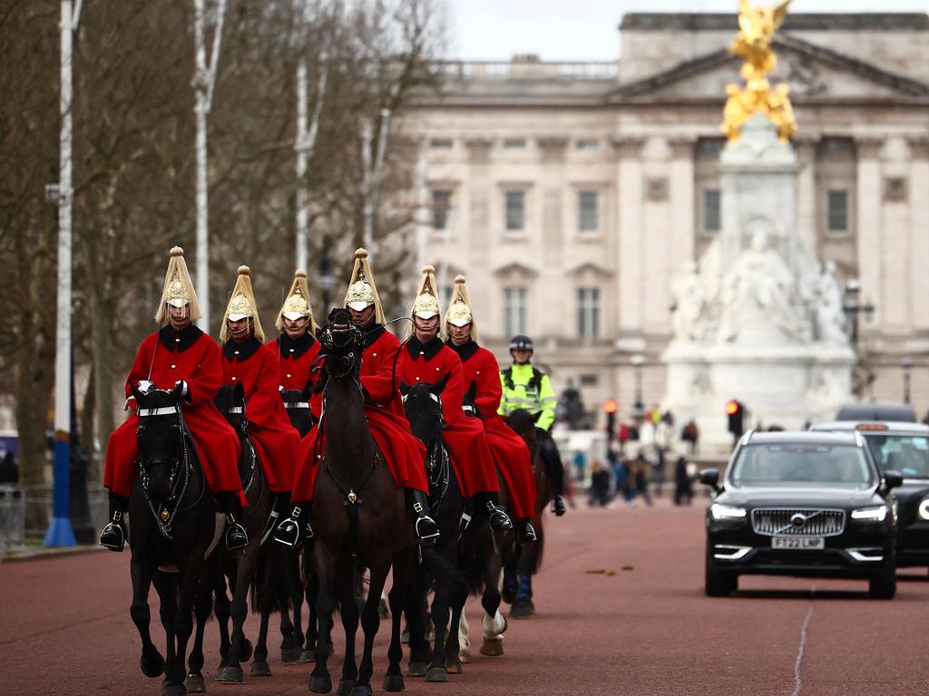 Life Guards, a unit of the Household Cavalry ride their horses past Buckingham Palace in London. Picture: AFP