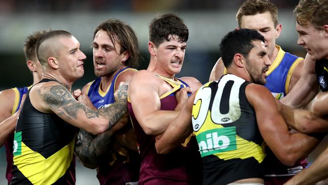 BRISBANE, AUSTRALIA - MAY 21: Lions and Tigers players scuffle during the round 10 AFL match between the Brisbane Lions and the Richmond Tigers at The Gabba on May 21, 2021 in Brisbane, Australia. (Photo by Jono Searle/AFL Photos/Getty Images)