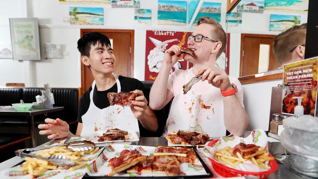 Zack Pham and Brant Fahey eating at Ribbett's Restaurant which has been an institution in Dutton Park for 40 years. Picture: Tara Croser