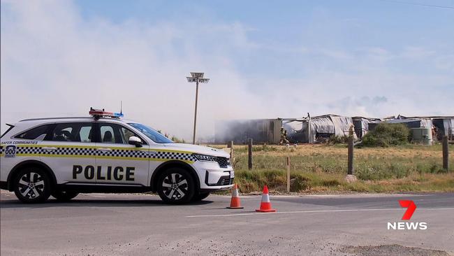 Police and fire crews attend a shed fire at Waterloo Corner. Picture: 7NEWS