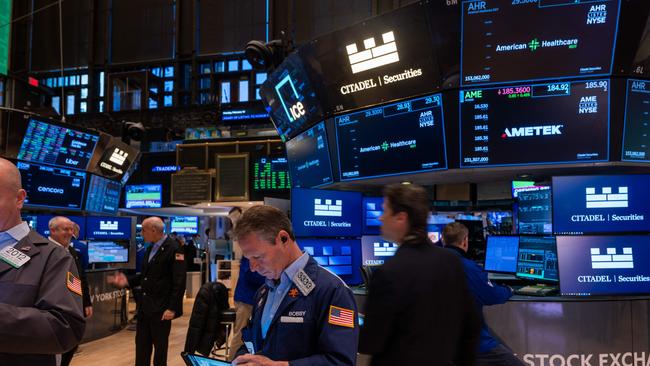 Traders on the floor at the New York Stock Exchange. Picture: Spencer Platt/Getty Images/AFP