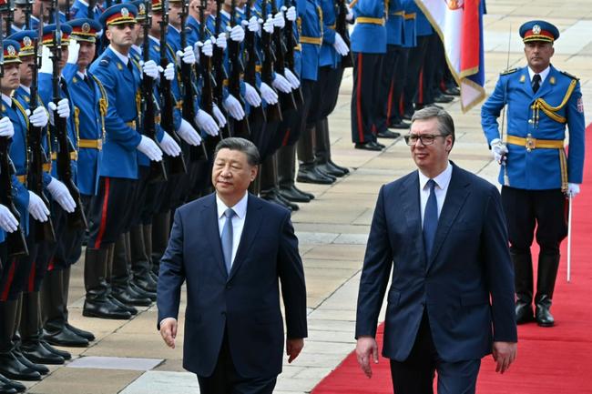 Xi and his wife Peng Liyuan were greeted by Vucic on a red carpet outside the main government offices