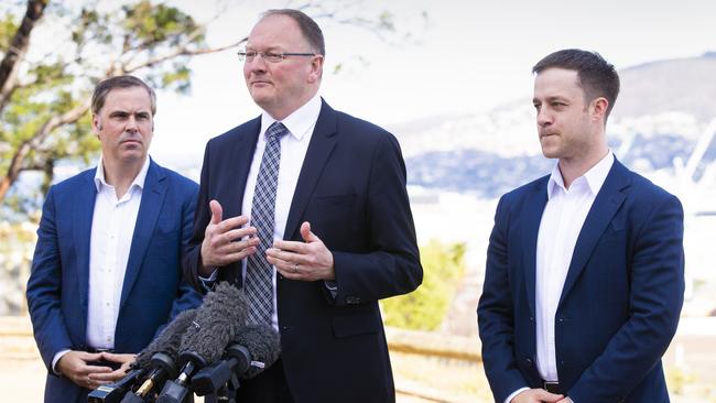 Housing Minister Roger Jaensch (centre) with the Property Council’s Brian Wightman and Matthew Pollock from the Master Builders Association. Picture: RICHARD JUPE