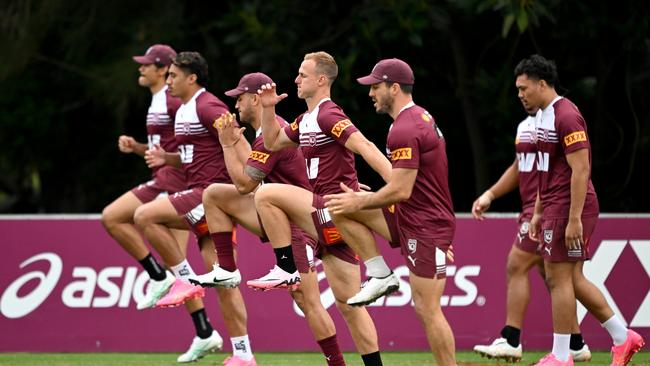 Daly Cherry-Evans, Ben Hunt and team mates are seen doing a warm up drill. Photo by Bradley Kanaris/Getty Images.