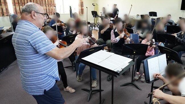 Newhaven College director of music Kirk Skinner instructs students during a music camp in an image taken from the school website.