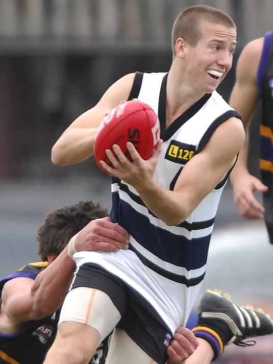 Kane Lambert tries to break clear of an opponent while playing for Northern Knights in the TAC Cup in 2009.