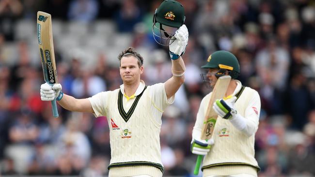 Skipper Tim Paine leads the applause for Smith’s century. Picture: Getty Images