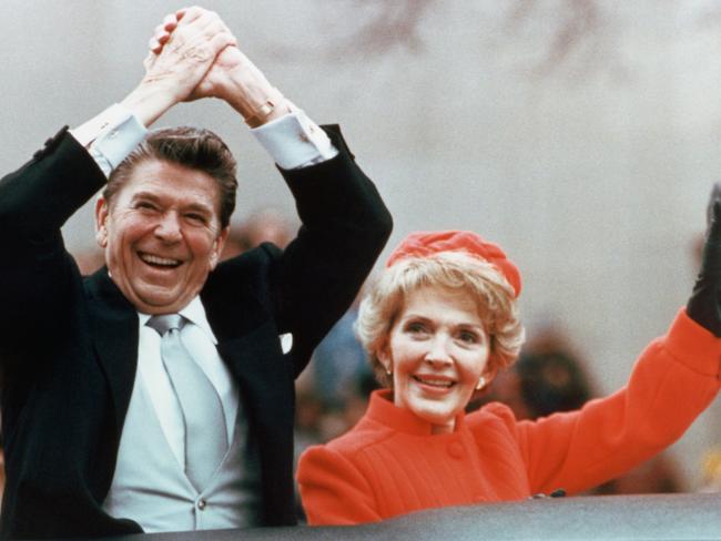 Ronald and Nancy Reagan waving and clasping hands in victory at Reagan's first inauguration, January 20, 1981. Picture: Corbis via Getty Images