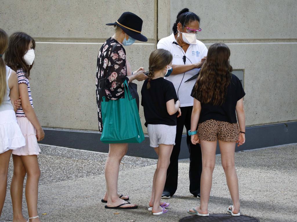 Parents and their children were seen lining up for testing at the Brisbane Convention Centre as children aged between five and 11 became eligible to get the COVID-19 vaccine from today. Picture: NCA NewsWire/Tertius Pickard