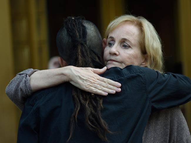 Lyn Ulbricht, mother of Silk Road founder Ross Ulbricht, gets a hug from a friend outside the Federal Courthouse May 29, 2015 in New York.