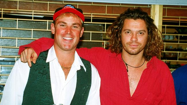 Shane Warne and Michael Hutchence. Picture: Getty