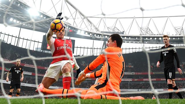 Alexis Sanchez of Arsenal scores the opening goal.